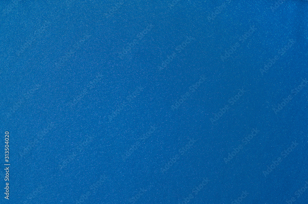 Rich matte even classic blue smooth satin fabric. Abstract texture and background for design.