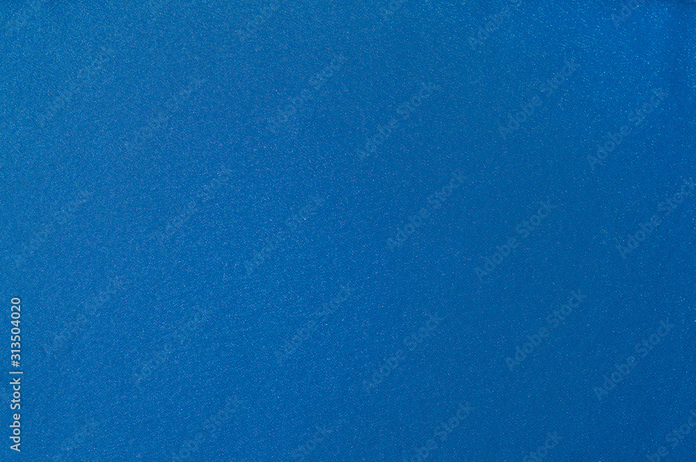 Rich matte even classic blue smooth satin fabric. Abstract texture and background for design. Rich matte even classic blue smooth satin fabric. Abstract texture and background for design.