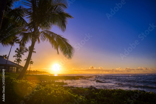 Fototapeta Naklejka Na Ścianę i Meble -  The sunrise over the beach in Kauai, Hawaii