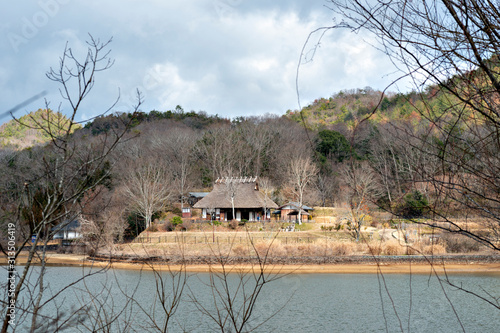 A traditional thatched roof Japanese house  preserved at a public park in Sanda, Hyogo, Japan.   photo