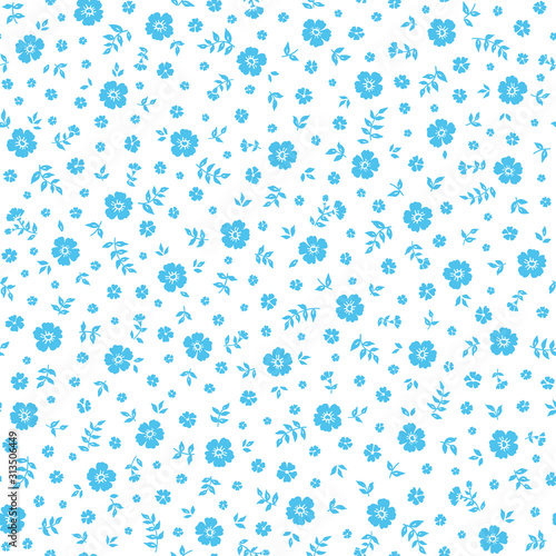 Seamless ditsy floral pattern in vector. Small blue flowers on a white background.	