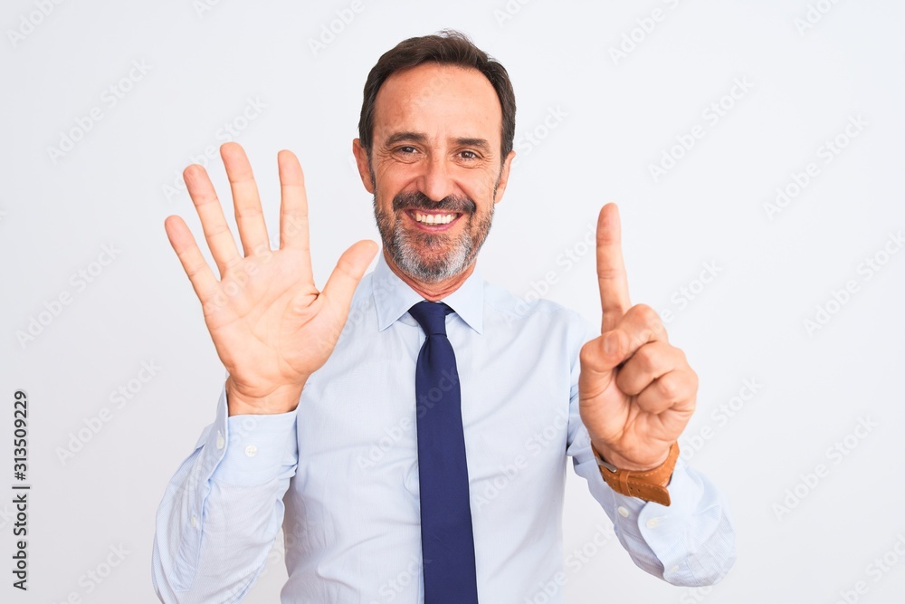 Middle age businessman wearing elegant tie standing over isolated white background showing and pointing up with fingers number six while smiling confident and happy. Middle age businessman wearing elegant tie standing over isolated white background showing and pointing up with fingers number six while smiling confident and happy.