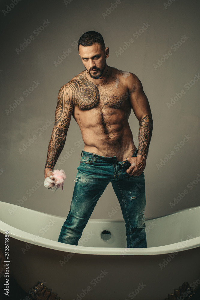 Foto Stock Sexy handsome topless male model with beautiful body. Sexy man  with muscle torso. Body with six packs and abs poses on dark background. |  Adobe Stock