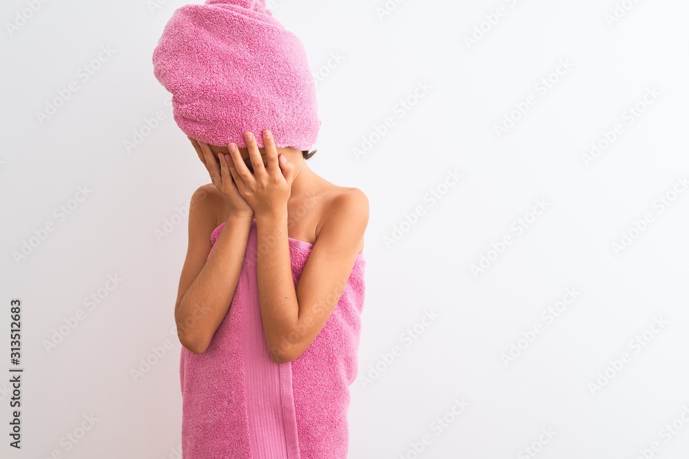 Beautiful child girl wearing shower towel after bath standing over
