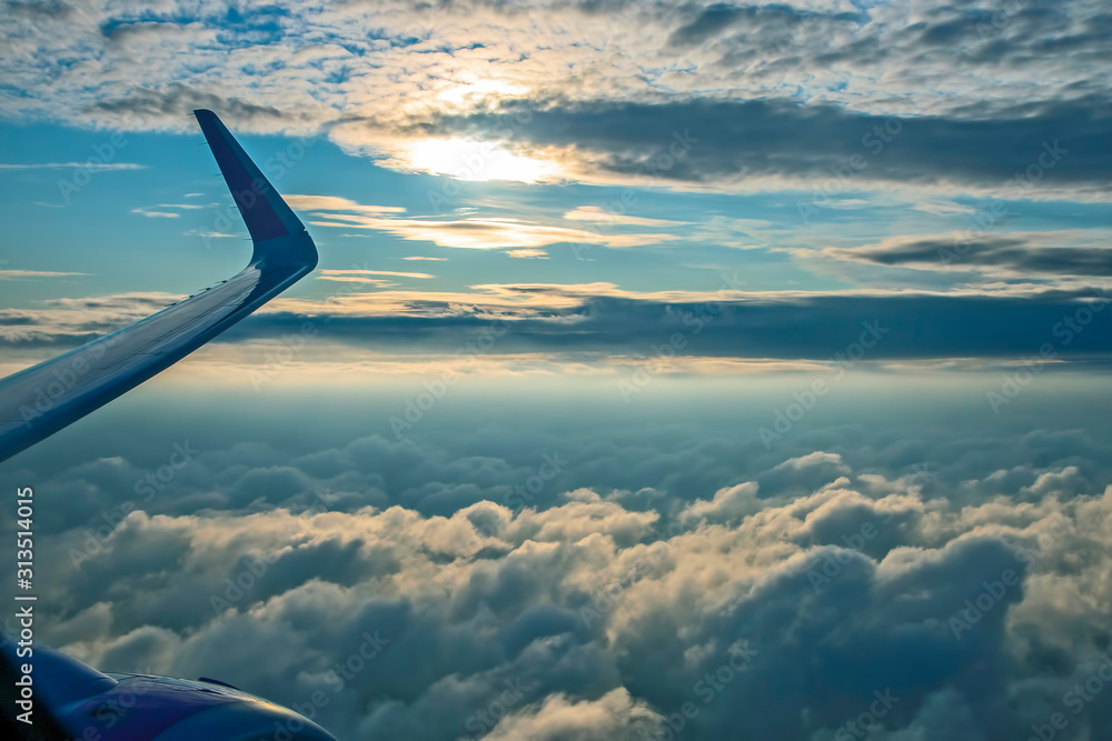 fluffy clouds from the plane window in flight fluffy clouds from the plane window in flight
