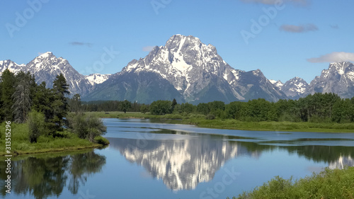 morning shot of mount moran at oxbow bend in wyoming