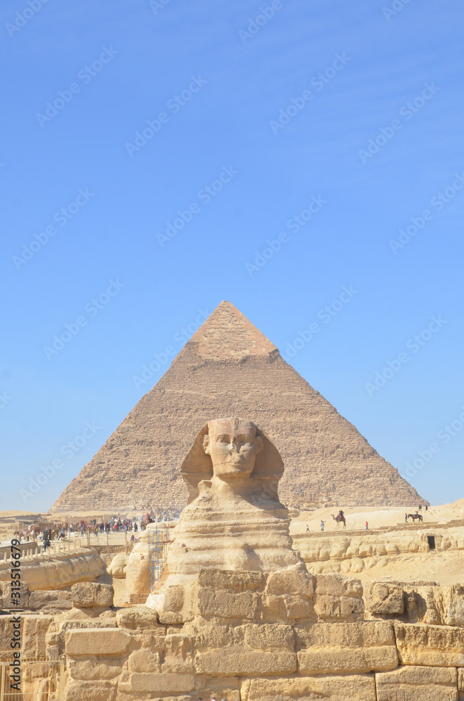 Great pyramid of Cheops and Sphinx in Giza plateau. The Great Pyramid of Giza at the back.