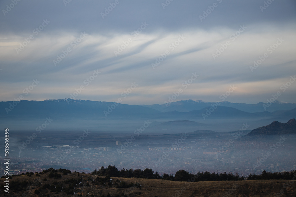 Fog and smoke caused by pollution in an urban city. Cityscape.