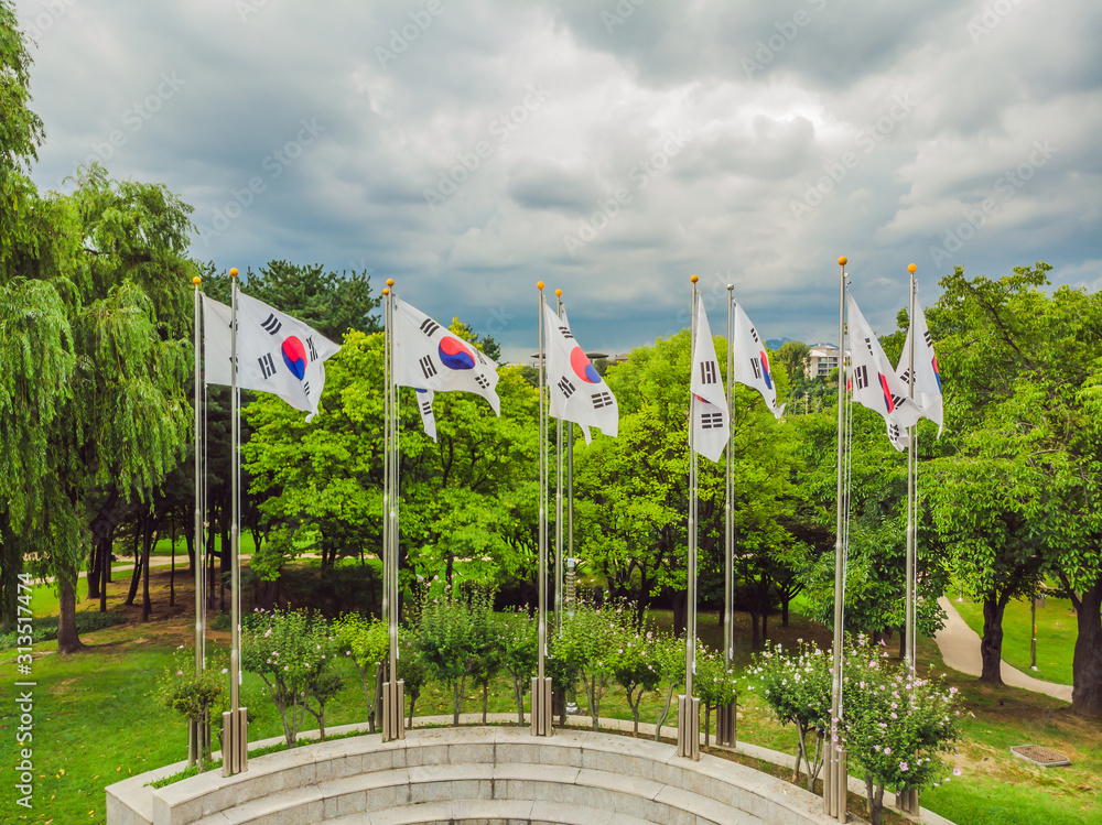 Fototapeta premium Many flags of South Korea on flagpoles