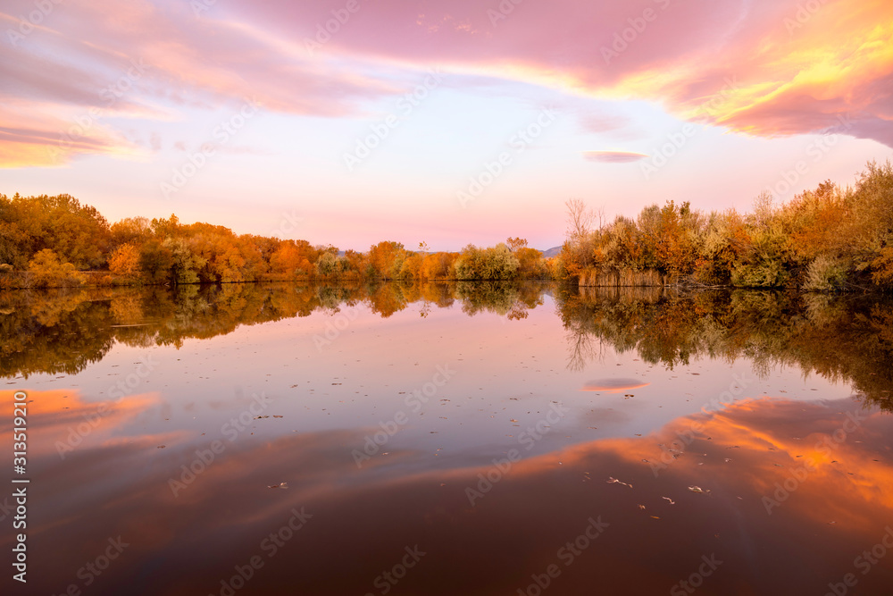 Fall Foliage reflecting in the lake at sunrise