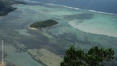 Natural wide shot showing colorful ocean pattern on the sea floor on windy day photo