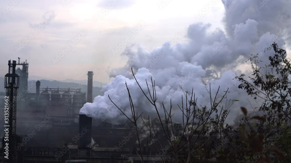 Industrial factory pollution, large smoke from pipes in atmosphere, near city, unclean air, poor visibility, stuffy - (4K) Industrial factory pollution, large smoke from pipes in atmosphere, near city, unclean air, poor visibility, stuffy - (4K)