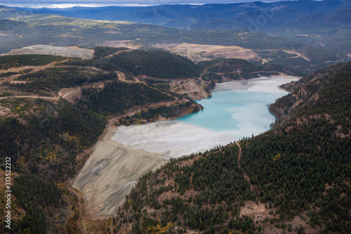 Aerial view of Copper Mine Tailing pond in the interior British Columbia, Canada. Taken during a fall season morning.