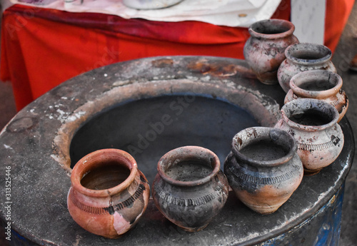 Hot earthenware pots on round clay oven. These pots are used for making Tandoori tea.