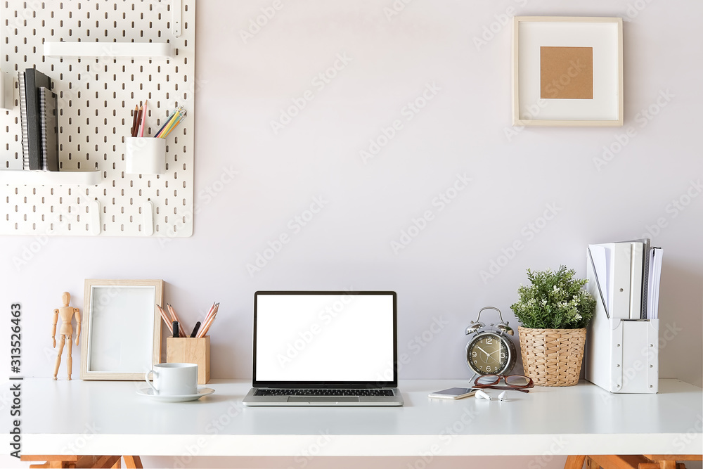 Fototapeta premium Workspace desk and laptop. copy space and blank screen. Business image, Blank screen laptop and supplies.