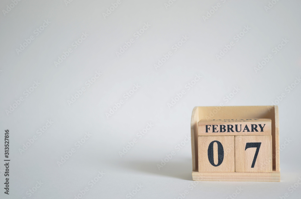 February 7, Empty white background with number cube on the table. February 7, Empty white background with number cube on the table.