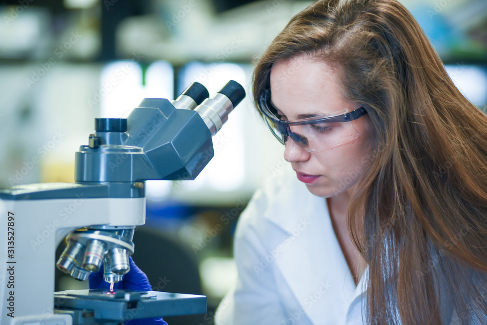 scientist in laboratory during covid-19 pandemic to perform research on Coronavirus vaccine / drug development scientist in laboratory during covid-19 pandemic to perform research on Coronavirus vaccine / drug development