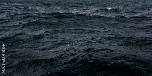 Fototapeta Naklejka Na Ścianę i Meble -  Dark and blue sea water surface