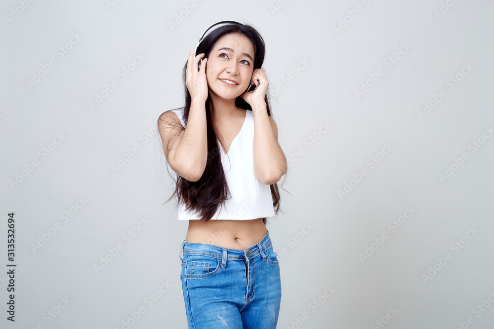 Asian woman wearing headphones dancing active Asian woman wearing headphones dancing active