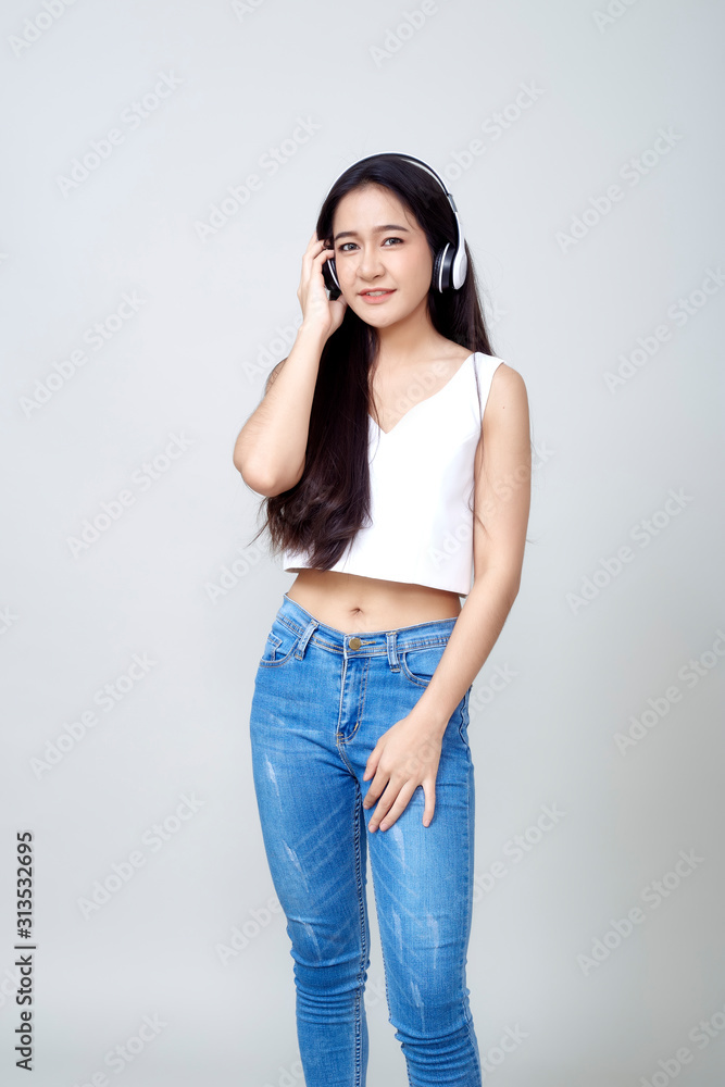 Asian woman wearing headphones dancing active Asian woman wearing headphones dancing active