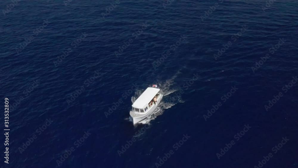 Aerial, close rotate over scuba dive boat, island of Roatan Aerial, close rotate over scuba dive boat, island of Roatan