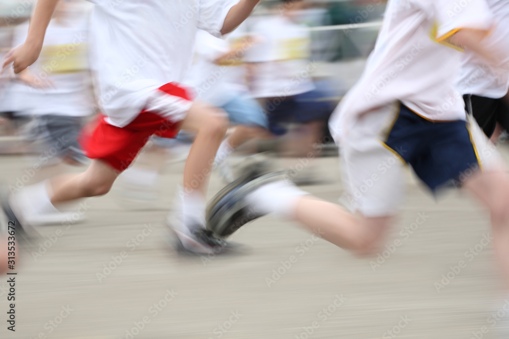 Children running a marathon, motion blurred image