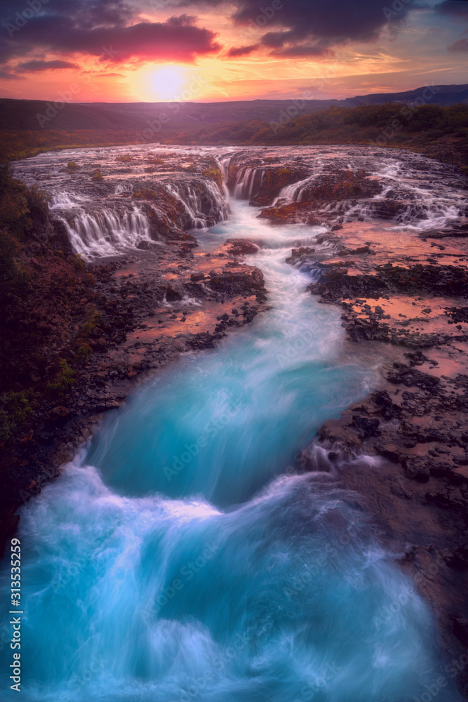 sunset over the Bruarfoss Waterfall sunset over the Bruarfoss Waterfall