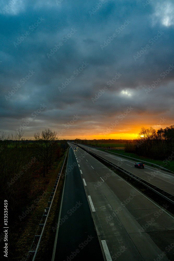 highway in the evening with sunset