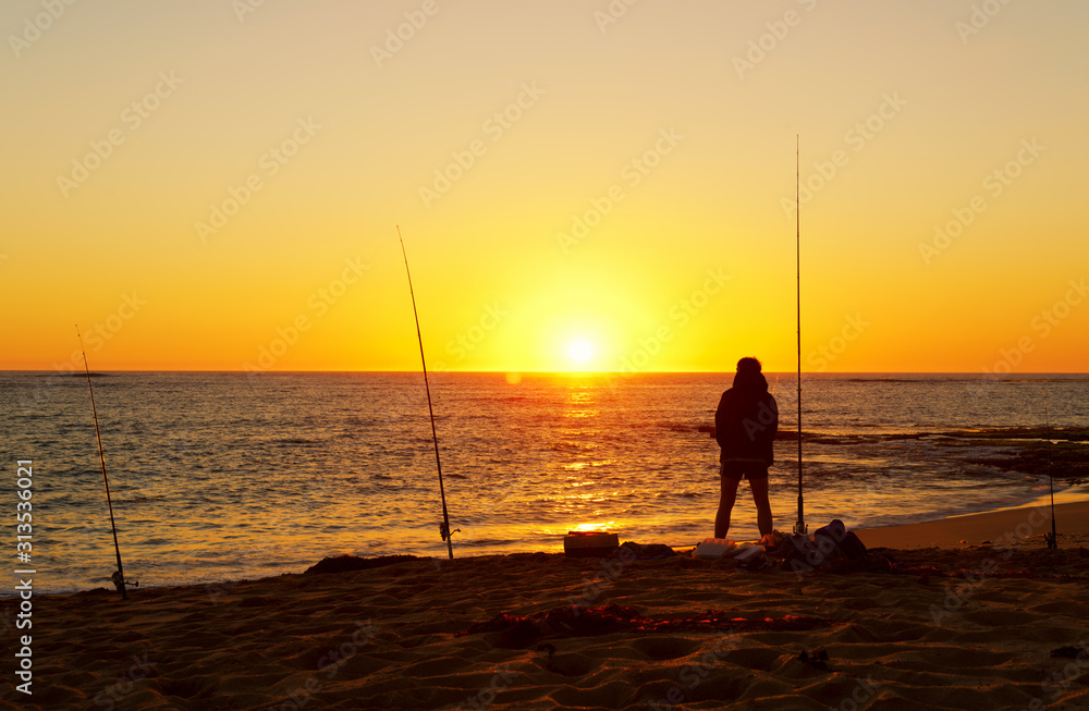 Enjoying fishing on sunset