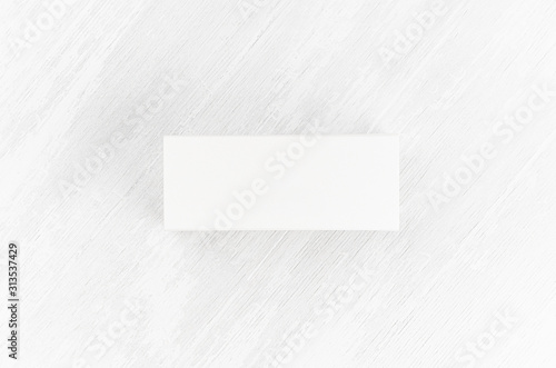 White blank closed paper rectangle box mock up on soft light white wood board top view for design, branding identity, advertising, presentation. © finepoints