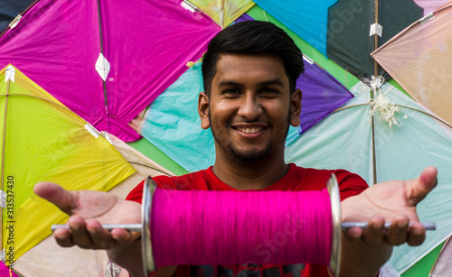 Young man with firki and pipuda for Makar Sankranti festival of India photo