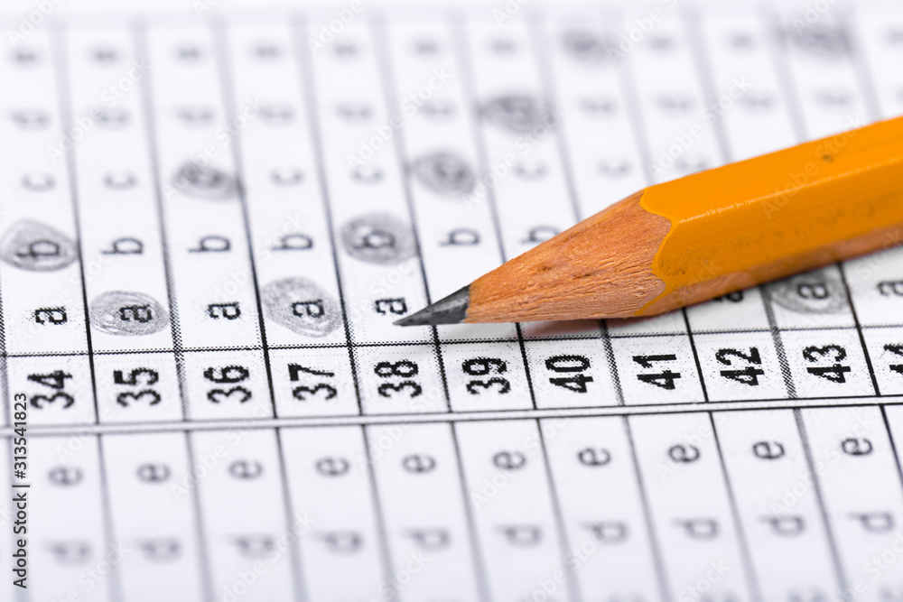 A pencil sitting on a test bubble sheet A pencil sitting on a test bubble sheet
