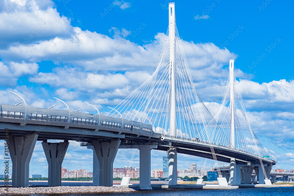 Obraz premium Saint Petersburg. Russia. Bridges Of Petersburg. Obukhov bridge against the blue sky and clouds. Panorama of cable-Stayed bridge in St. Petersburg. View of the city on a summer day. Travel to Russia.
