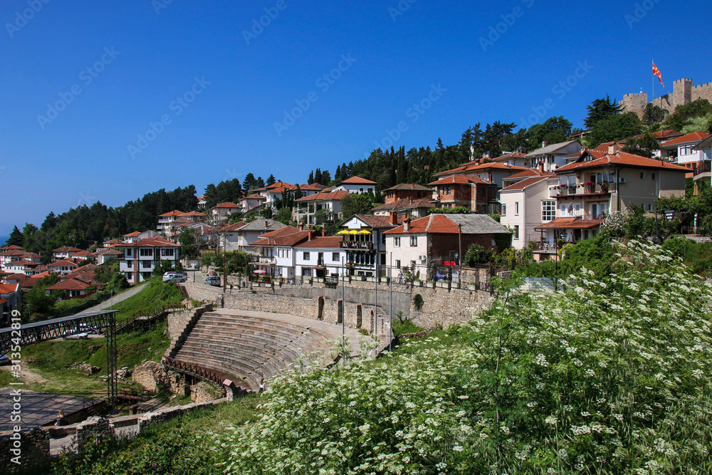 Antique ancient roman amphitheater or antique theatre of Ohrid with view on old town of Ohrid and Lake Ohrid, Republic of North Macedonia
