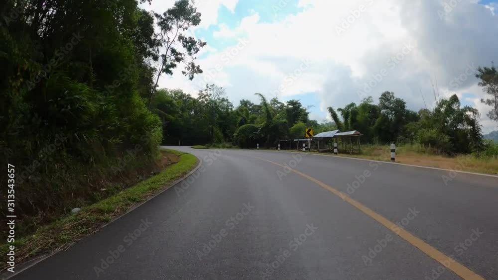 Time-lapse journey on the countryside road fast movement speed in the rural place with wood and forest Time-lapse journey on the countryside road fast movement speed in the rural place with wood and forest