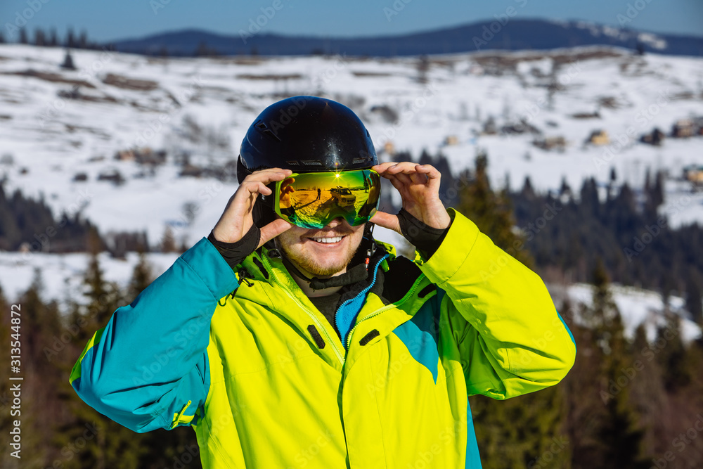man in helmet and ski mask. reflection. winter activity man in helmet and ski mask. reflection. winter activity