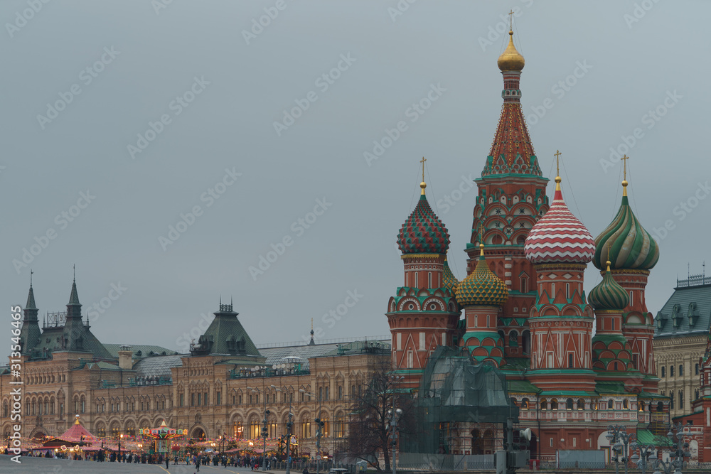 Long exposure photography of bright illuminated Christmas Moscow citiscape. Red Square, facade of the Saint Basil's Cathedral and GUM (central department store). Touristic and festive mood concepts. Long exposure photography of bright illuminated Christmas Moscow citiscape. Red Square, facade of the Saint Basil's Cathedral and GUM (central department store). Touristic and festive mood concepts.