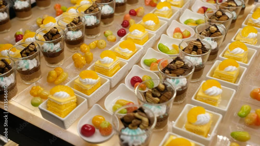 Glass shots pastry, wedding catering food, mini canapes food, tasty dessert, Beautiful decorate catering banquet table, snacks and appetizers, wedding celebration Glass shots pastry, wedding catering food, mini canapes food, tasty dessert, Beautiful decorate catering banquet table, snacks and appetizers, wedding celebration