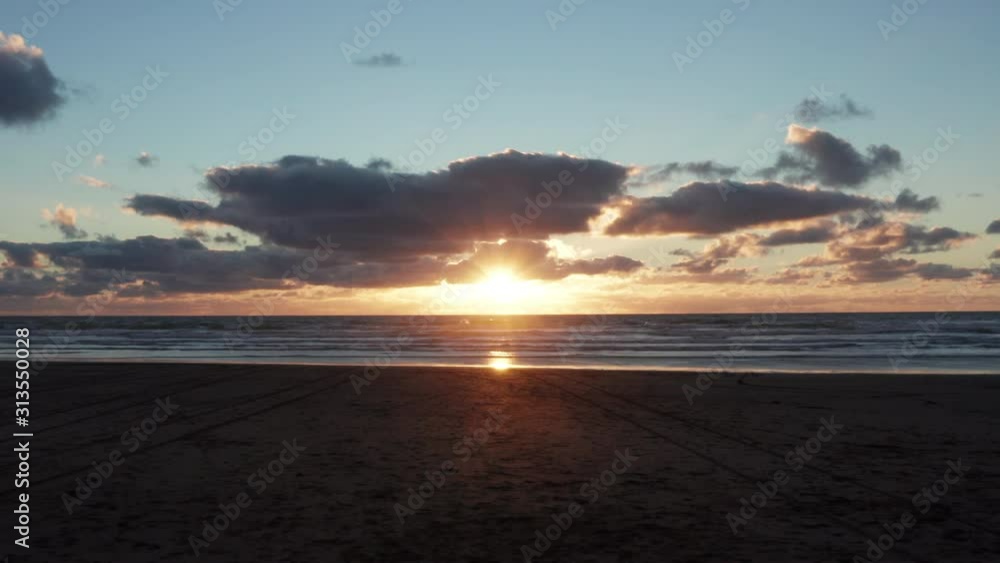 Scenic sunset landscape of Bethells Beach in Auckland region, NZ Scenic sunset landscape of Bethells Beach in Auckland region, NZ