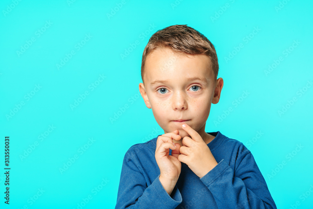 model child posing on turquoise background model child posing on turquoise background