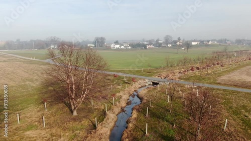 Aerial of riparian buffer, trees and vegetation protecting stream, water quality from sediment and nutrient runoff, EPA controls