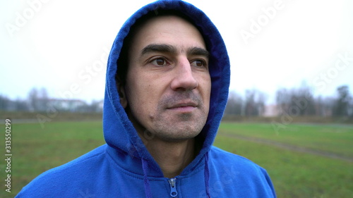 Quadro em tela anger problem, man in a hood looking aggressive, trying to provoke someone for f