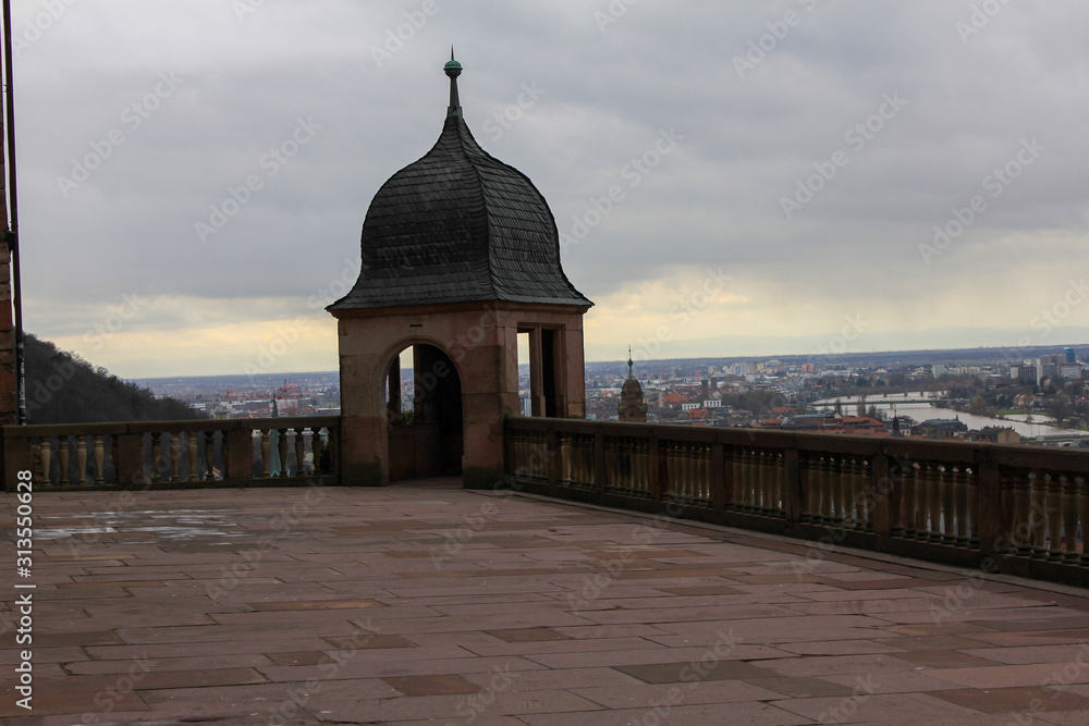 Heidelberg city, Baden-Wurttemberg state, Germany. Old town (Altstadt) and Old Karl Theodor bridge (Alte Brucke) over Neckar river on a background. View from Heidelberg Castle historical buildings