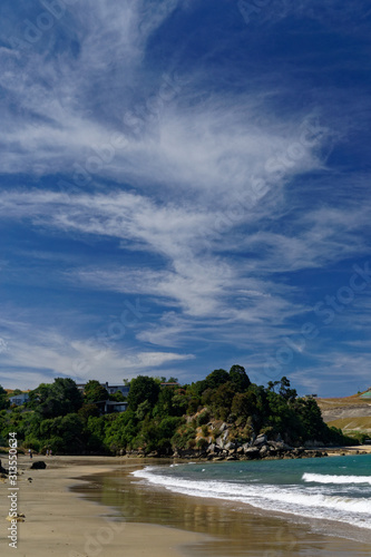 The golden sands of Stephens Bay beach, New Zealand.