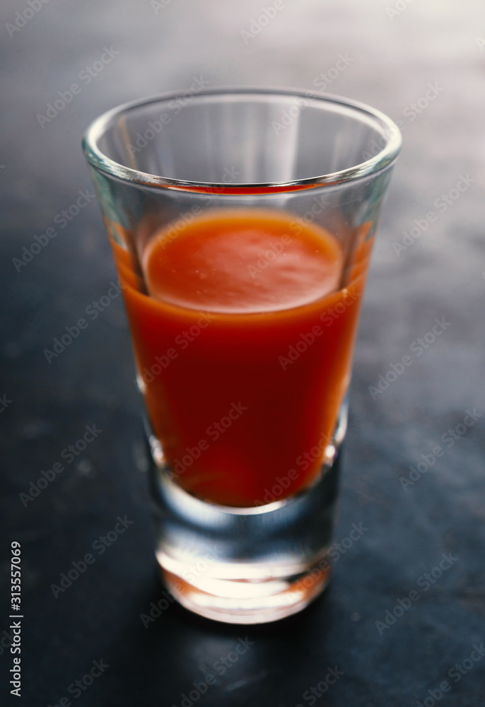 Bloody mary cocktail on a concrete dark table Bloody mary cocktail on a concrete dark table