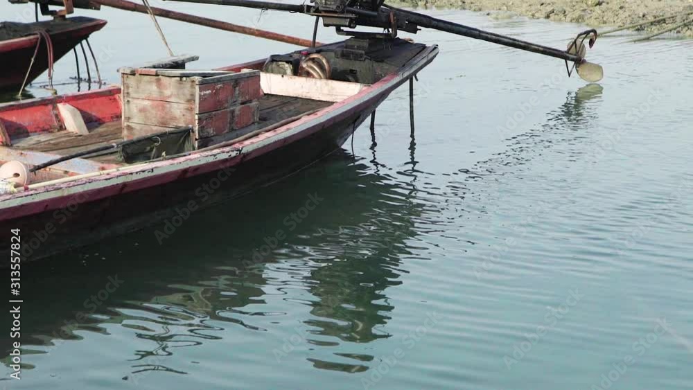 Local old fishing boats floating on ripple water sea Local old fishing boats floating on ripple water sea