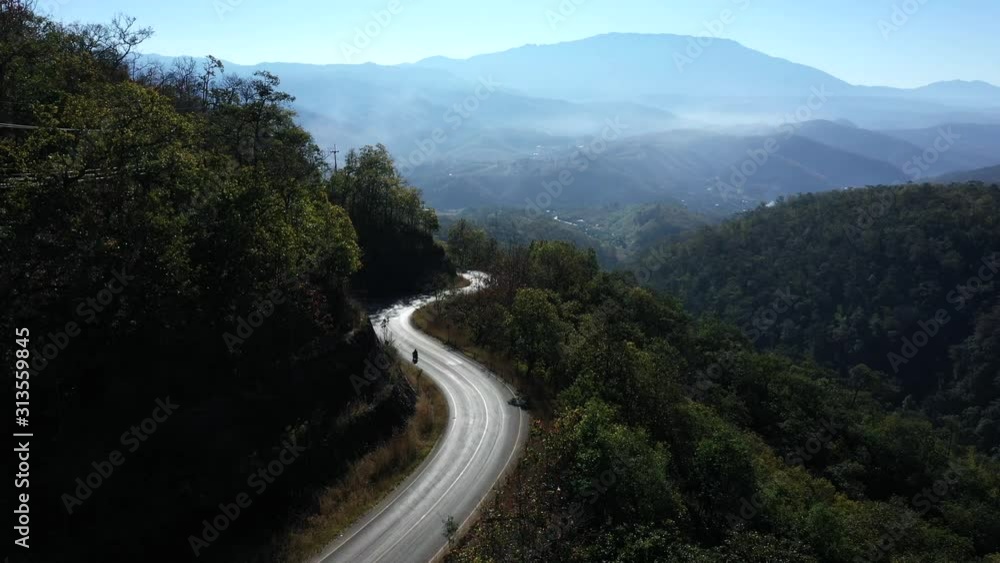 Drone Shot Following Motorcycle on Mountainside Drone Shot Following Motorcycle on Mountainside