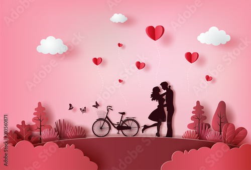 Cute couple in love hugging with many hearts floating. photo