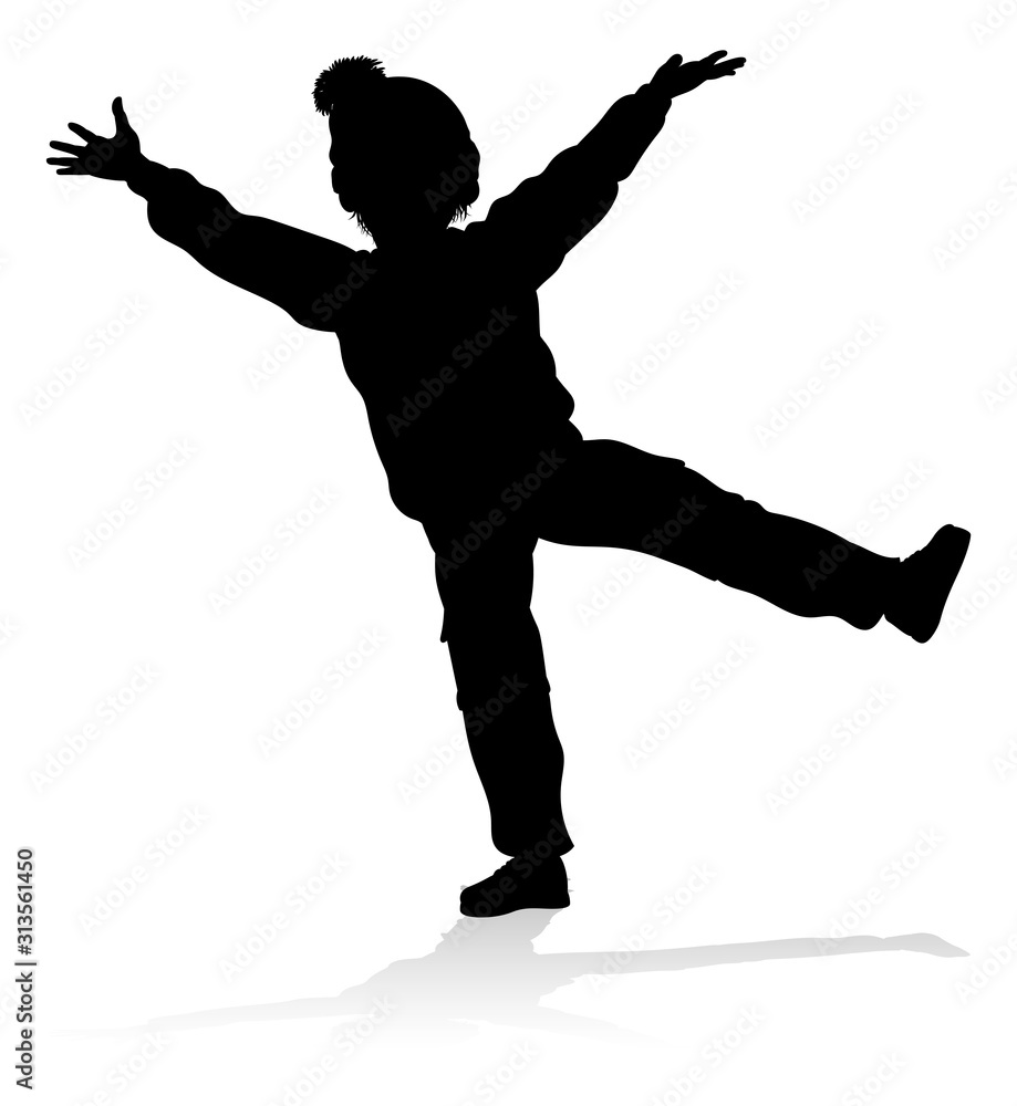 A child in silhouette playing in Christmas or winter cold weather clothing A child in silhouette playing in Christmas or winter cold weather clothing