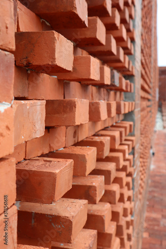Red bricks wall material close up